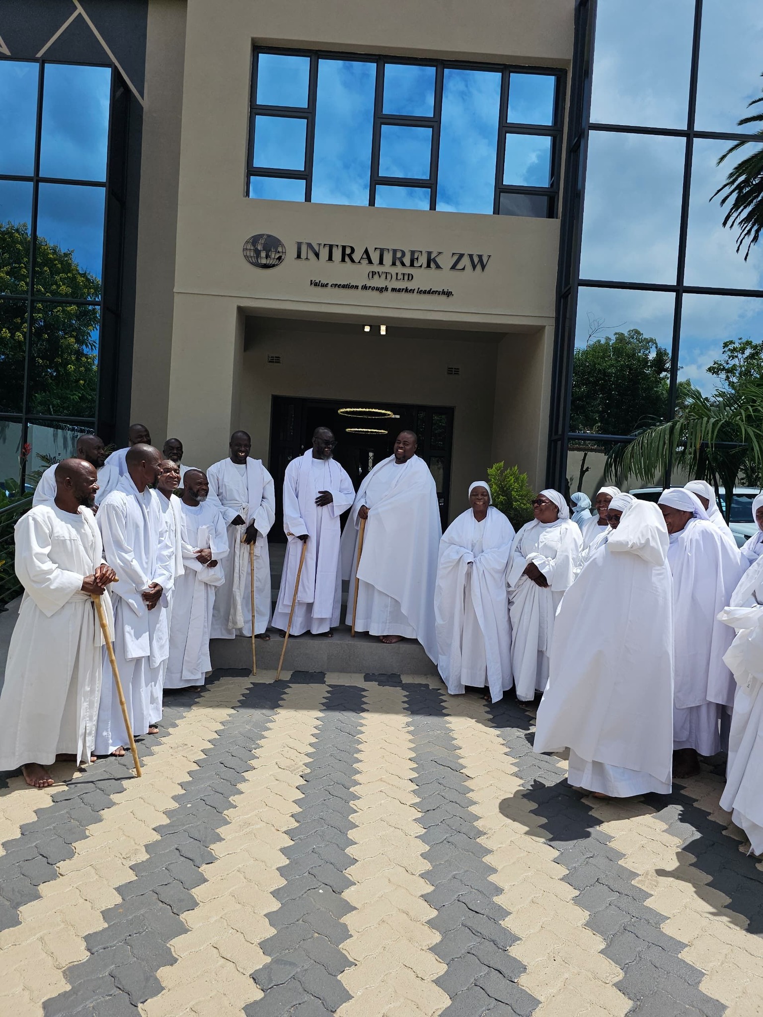 Sir Wicknell with church members at Intratek Headquarters
